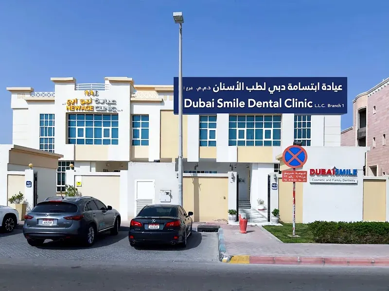Dubai Smile Dental Clinic exterior with street signage and parked cars