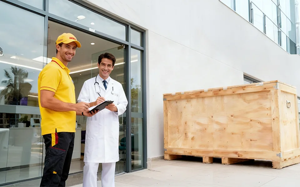 Door-to-door delivery of a packed dental equipment crate to a clinic