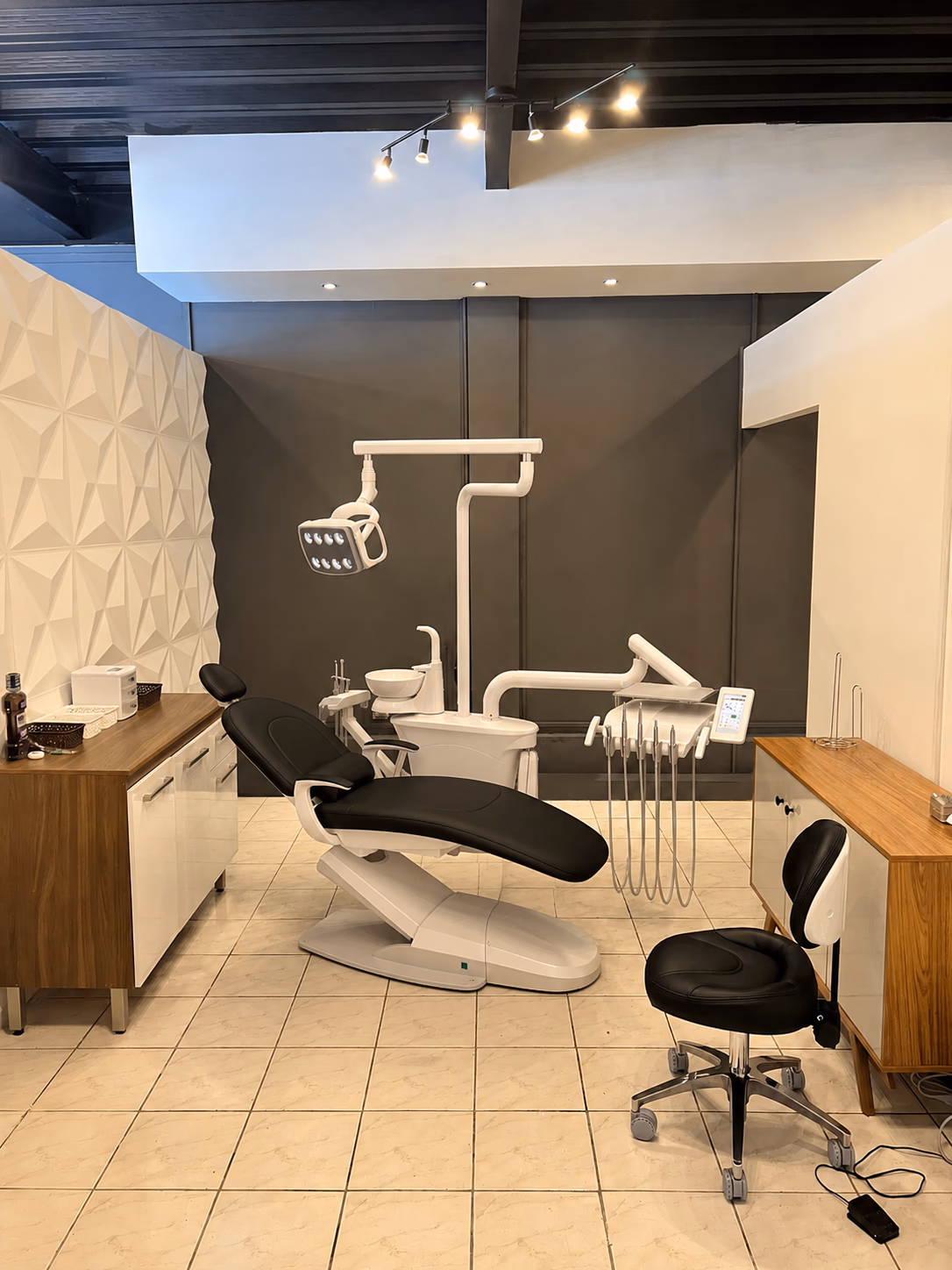 B100L Galaxy dental chair with black upholstery in a finished treatment room