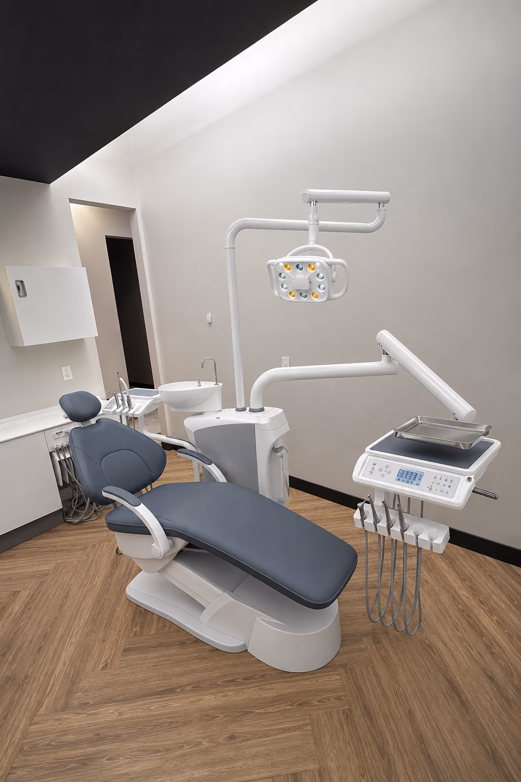M200(L) dental chair with gray upholstery in a finished treatment-room setting