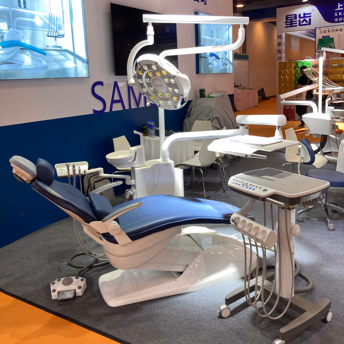 S680 dental chair with a new implant surgical light displayed at an exhibition