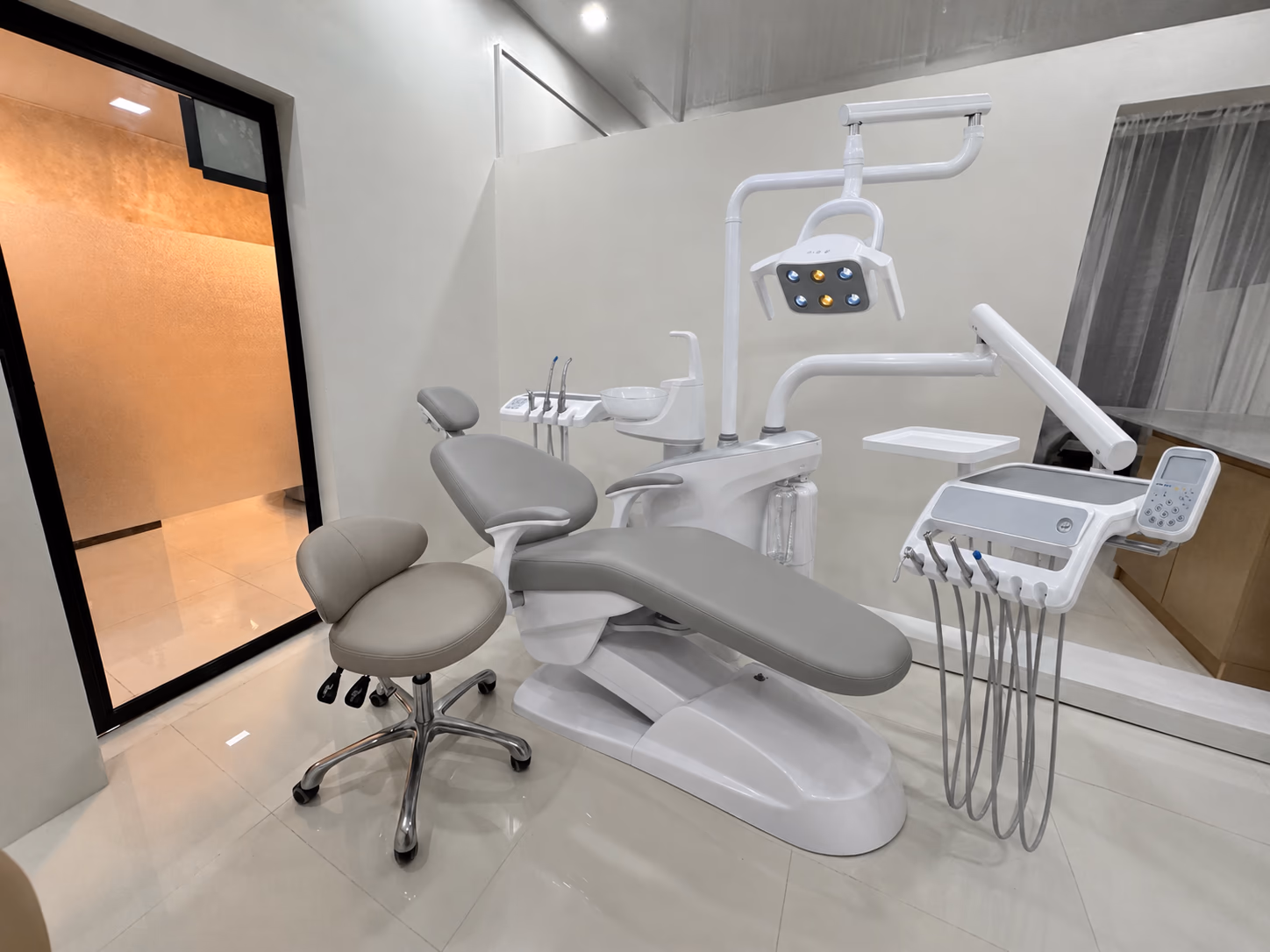 Gray V3 Luxury dental chair and operator workspace in a finished customer clinic